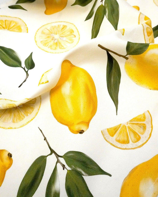 Close-up of the hand-drawn lemons on a cotton tea towel